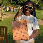 A customer holding the Life Aligned gift bag after purchase