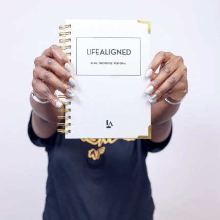 Woman holding Grey Life Aligned Planner