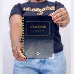 Woman holding Black Life Aligned Planner