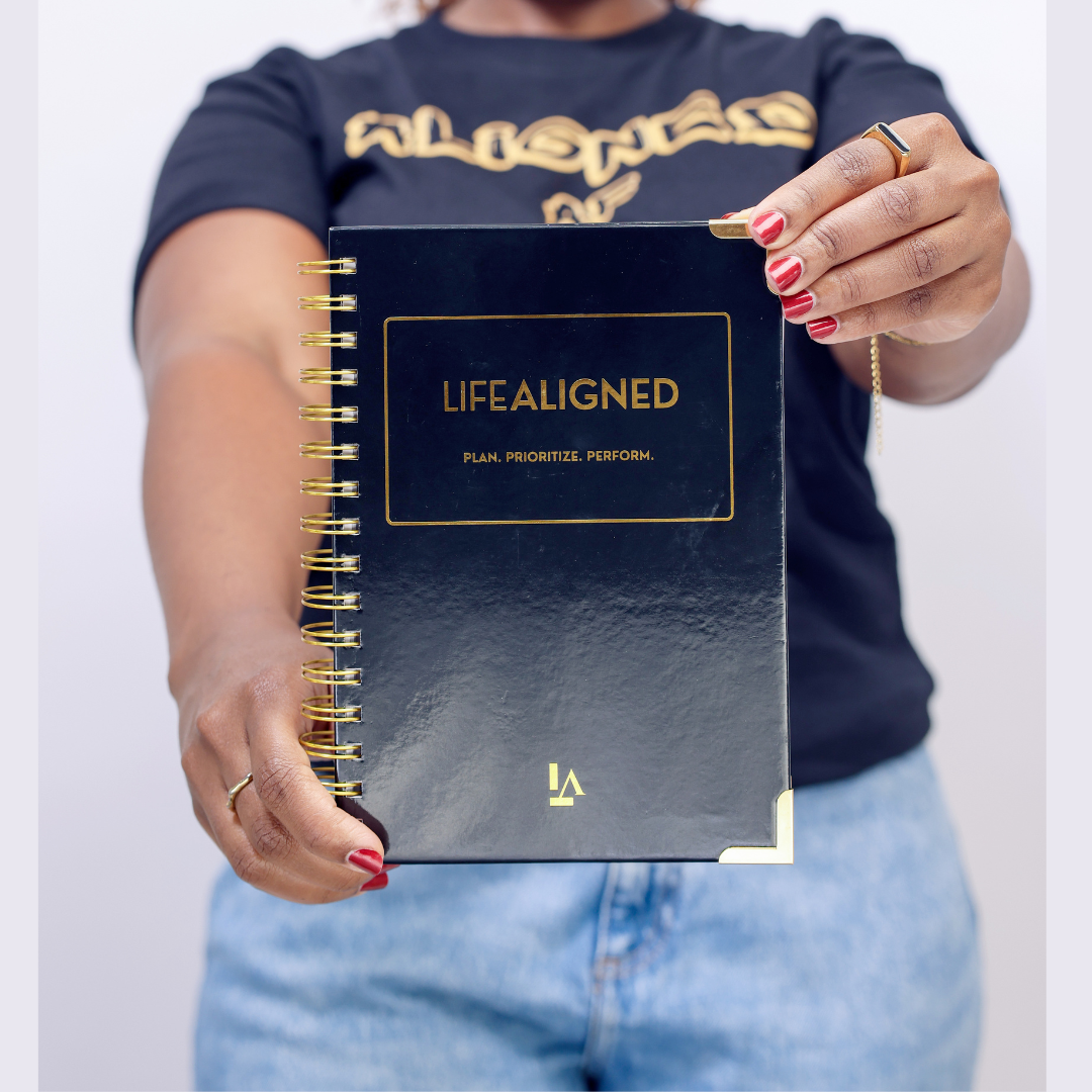 Life Aligned Planner Black in hand Woman holding Black Life Aligned Planner