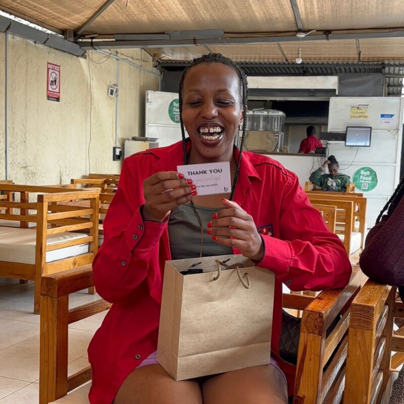 Happy customer holding Life Aligned Planner package